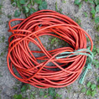 Orange Extension cord, in a coil on the ground. Mostly Circular by Roger H. Goun on Flickr, used under a CC-BY 2.0 license.